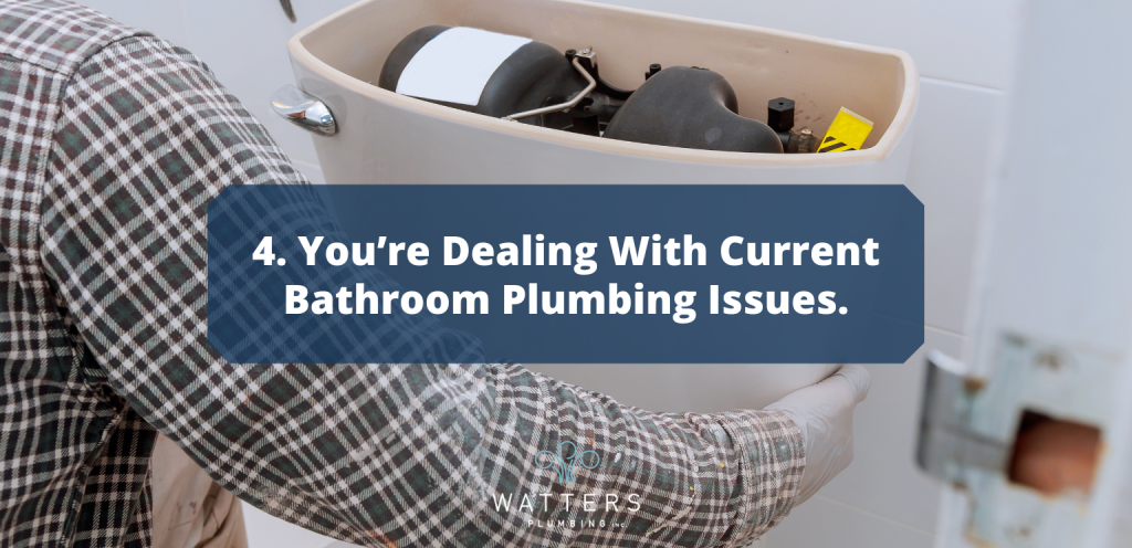 Photo of someone with the tank of a toilet open and text over top that says, "You're Dealing with Current Bathroom Plumbing Issues"