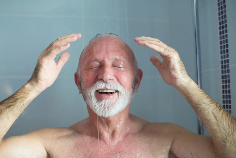 Elderly man enjoying his walk in shower